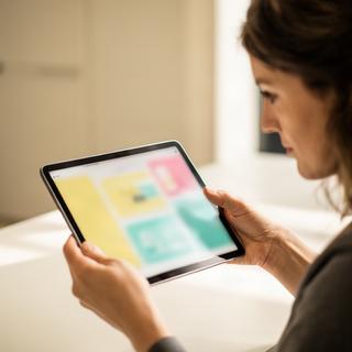 Teami Nafsinger testing a gas price comparison interface on a tablet
